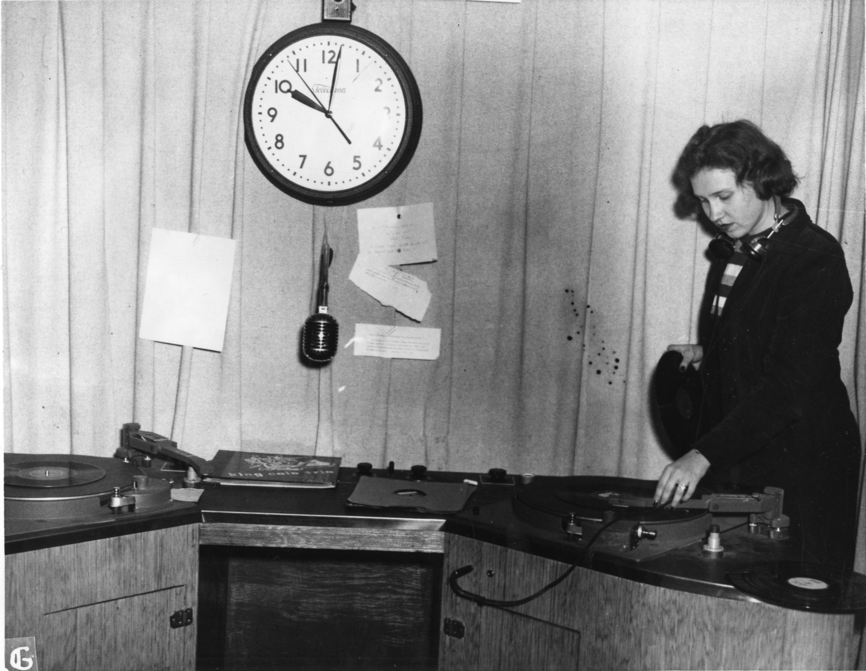 From RUTGERS NEWS SERVICE, year unknown – WRSU ON THE AIR AFTER FACELIFT:  Joan Hendricks of Bridgeton rehearses her weekly program of news for the girls of the New Jersey College for Women heard over the Rutgers University student station WRSU in the newly-renovated studios.